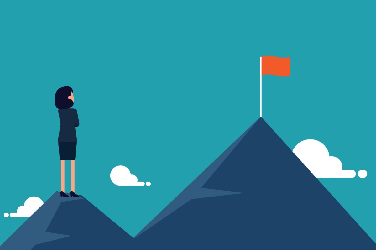 Businesswoman standing with looking to another higher mountain. Marketing best practices for professional service firms and high growth firms.